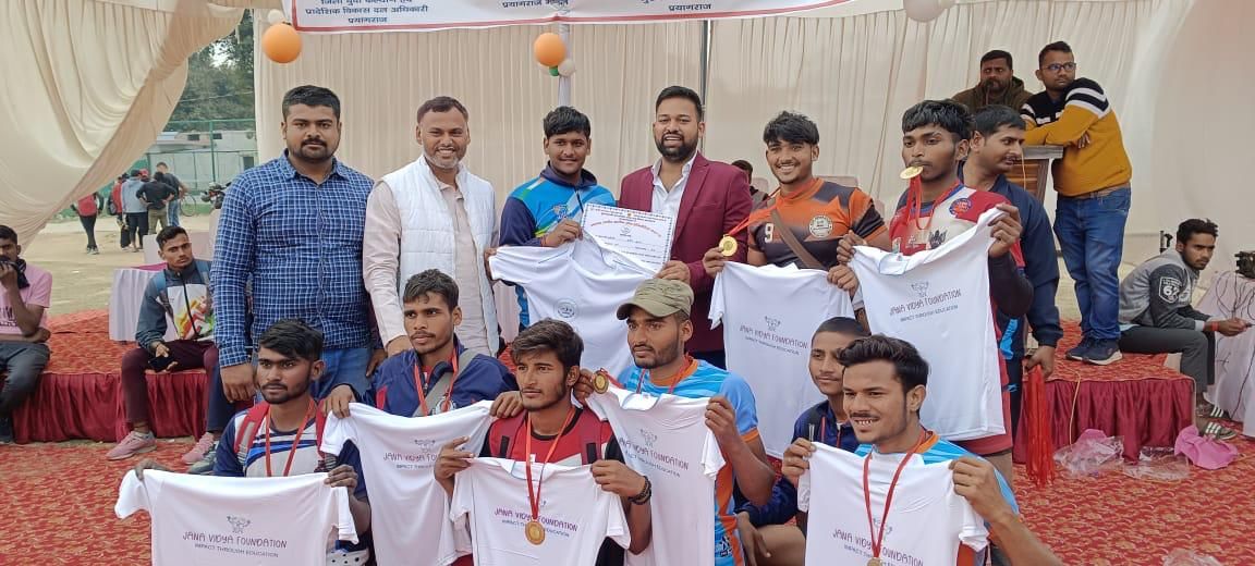 Sports team with Jana Vidya Foundation t-shirts at Rural Sports League awards in Prayagraj